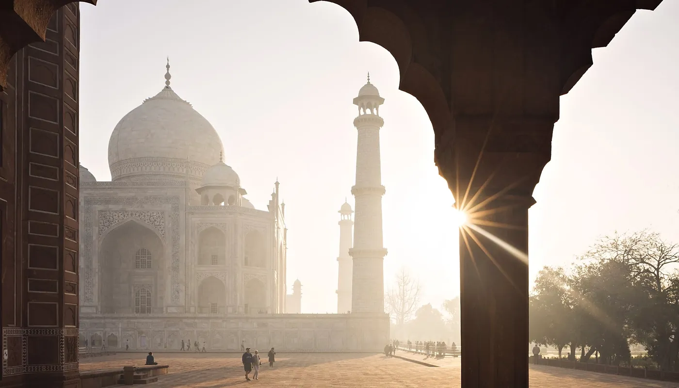 The Taj Mahal at first light, framed by the arcade of the Great Gate