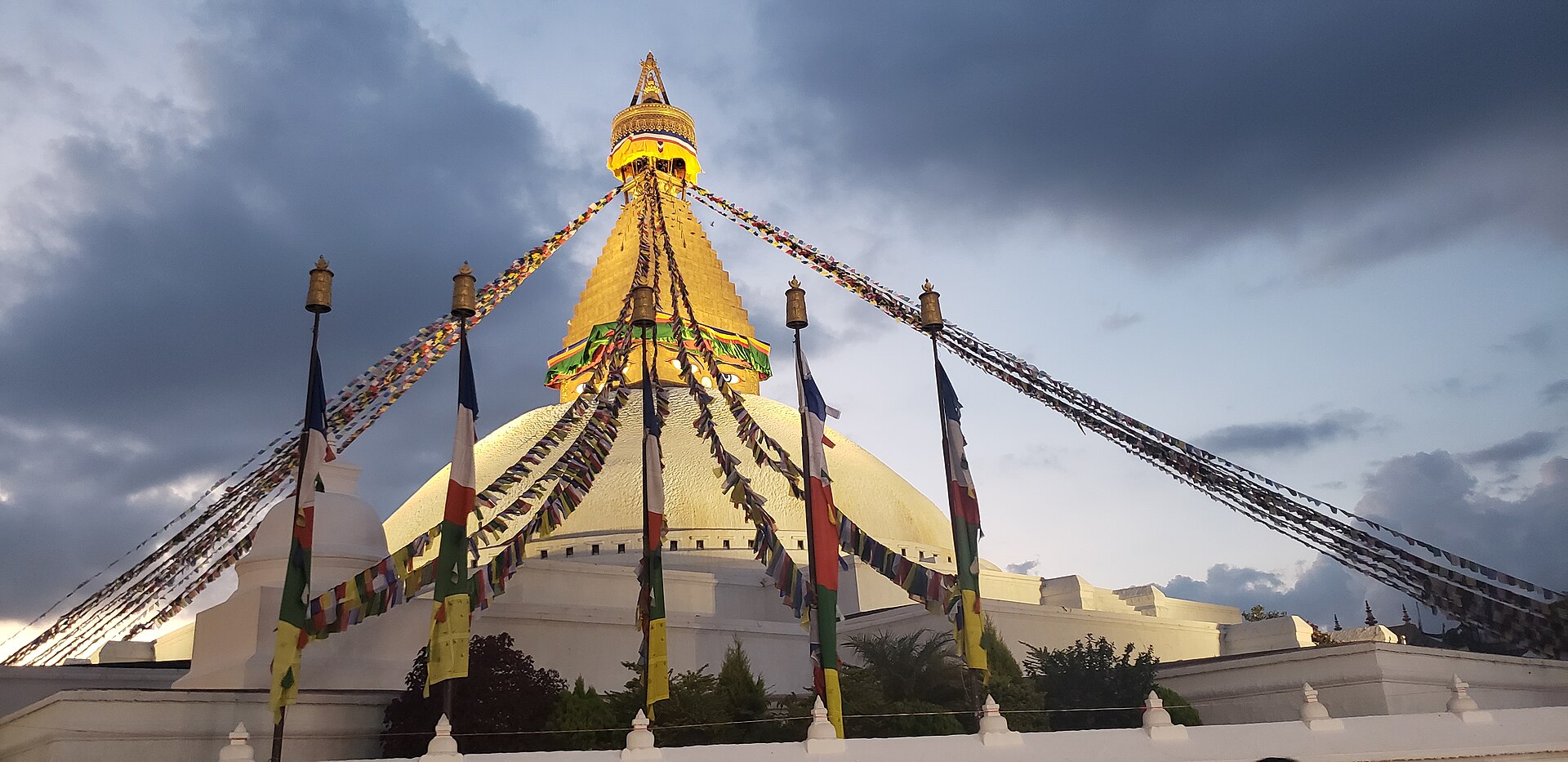 Boudhanath Stupa with prayer flags at dusk, Kathmandu, Nepal